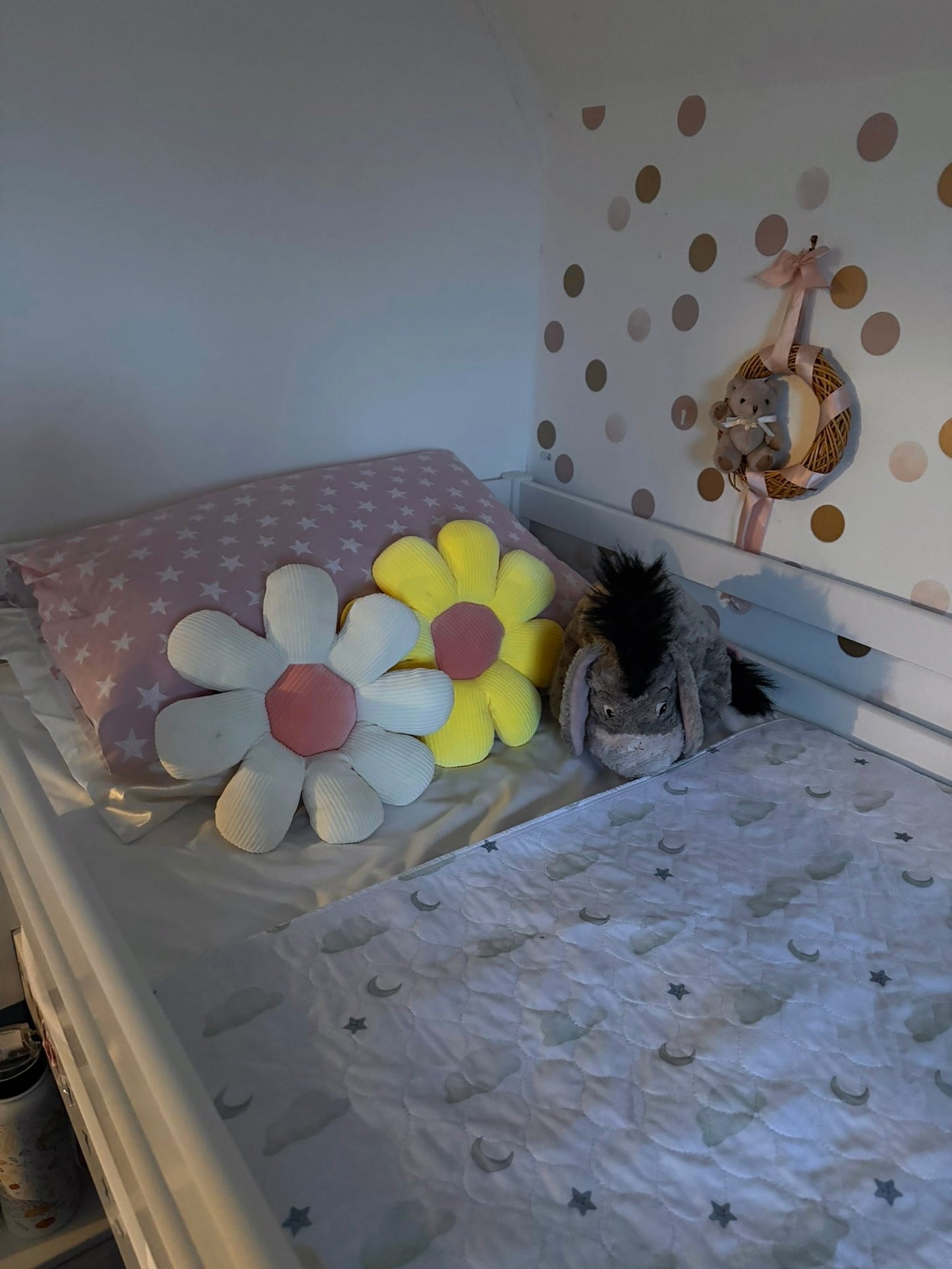 Children's room with decorative pillows, wall stickers, and Sleepy Stars Mattress Bed Sheet Protector.